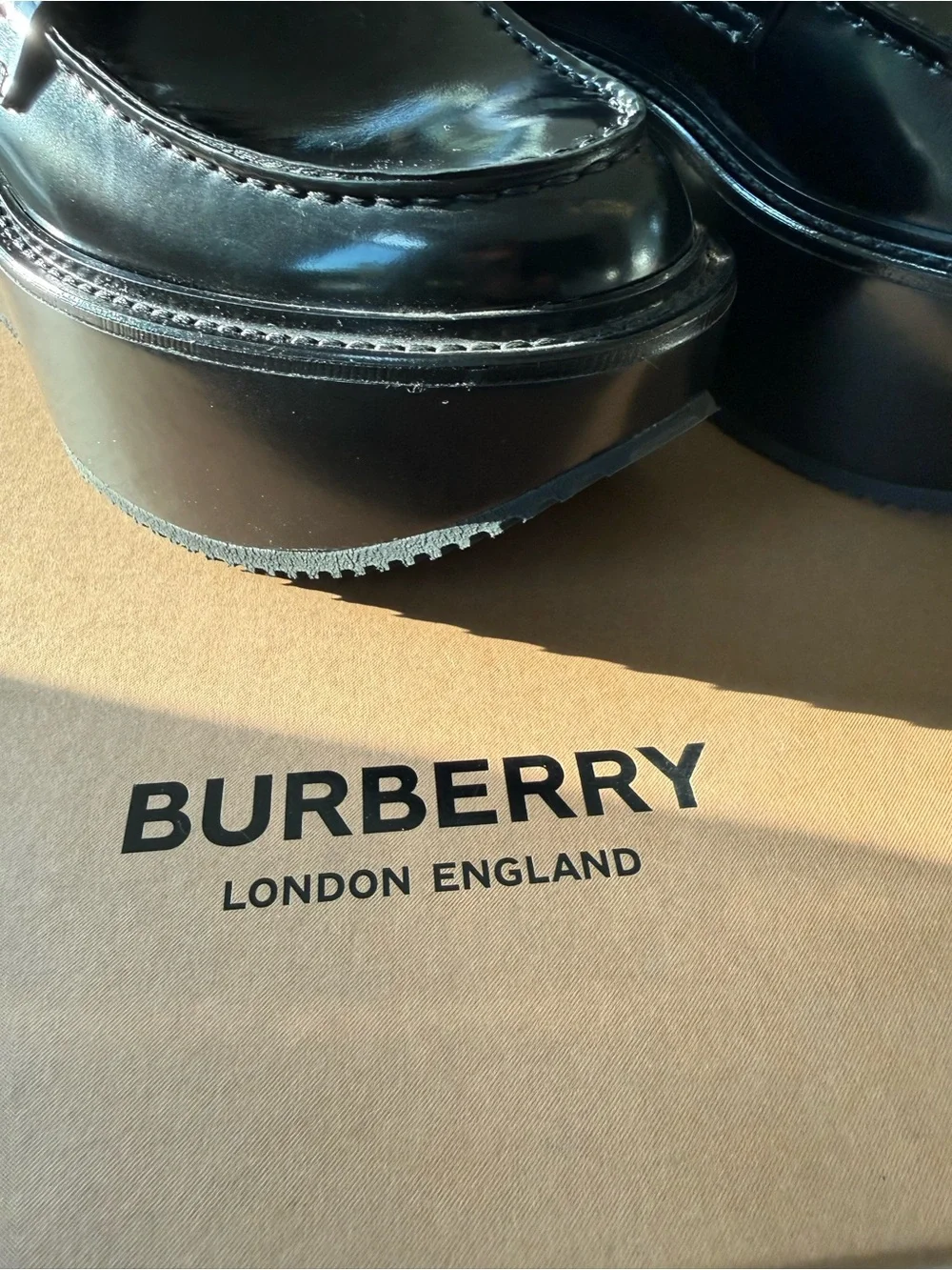 Burberry Black Patent Platform Loafers with Silver-Tone Medallions